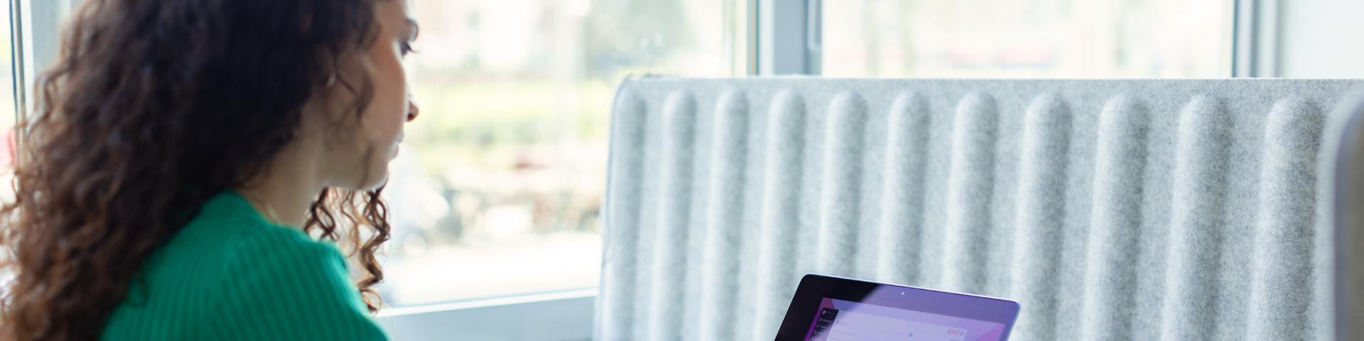 Employee woman taking notes on a project management software