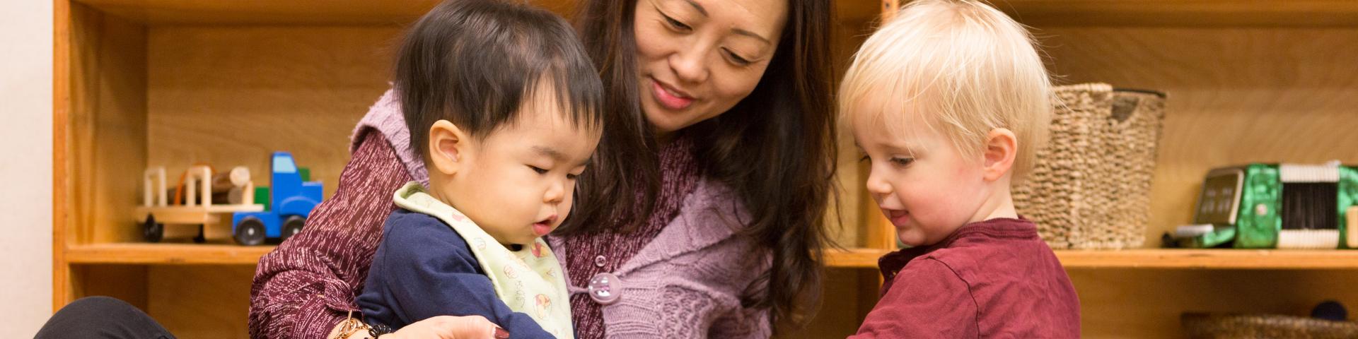 Children and care giver at Emma's Early Learning and Child Care Centre