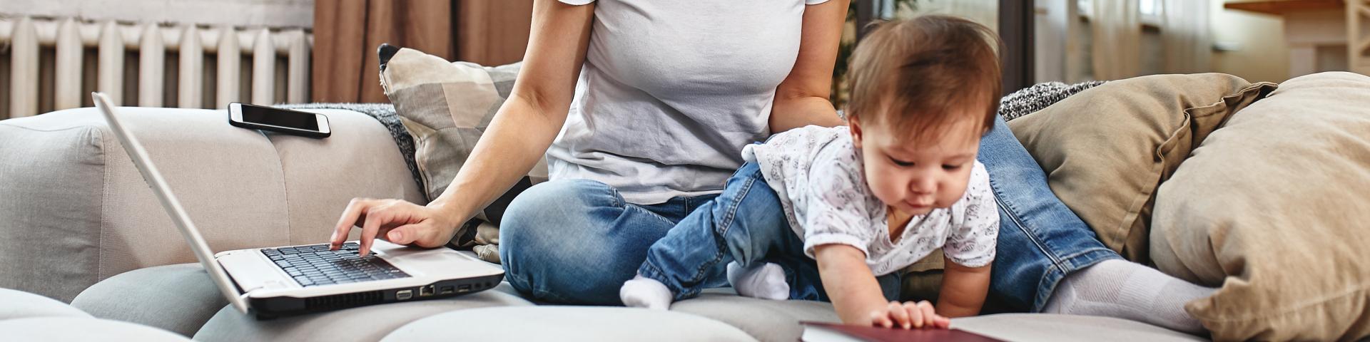 Woman working and taking care of baby