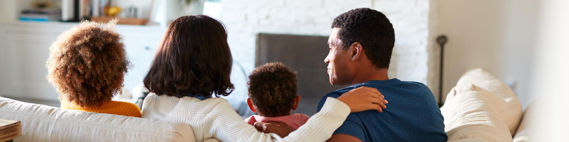 Family watching tv together