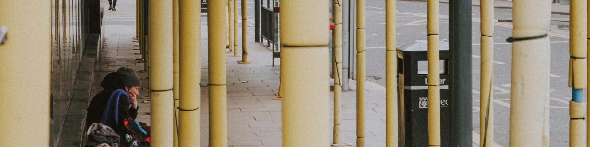 Homeless person among a construction structure