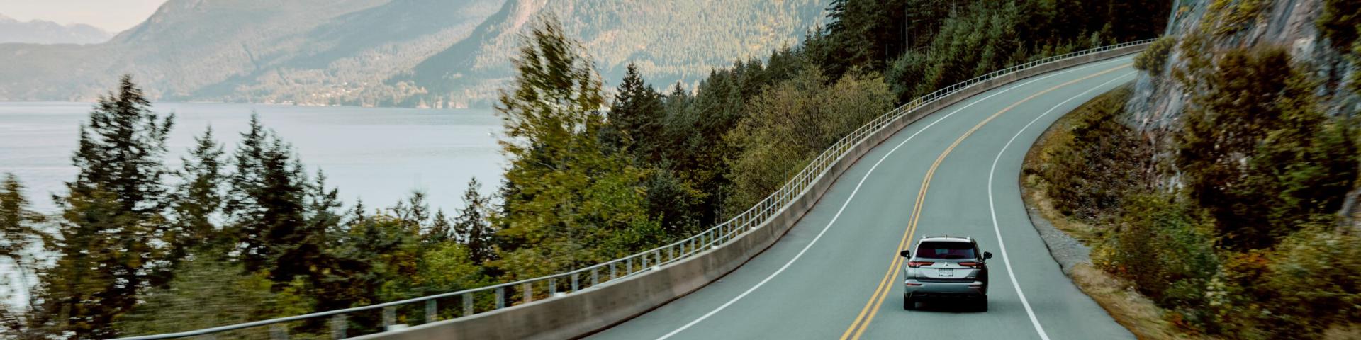 A photo of a car driving up the Sea to Sky Highway in British Columbia
