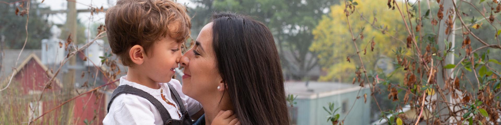 Mother and son hugging