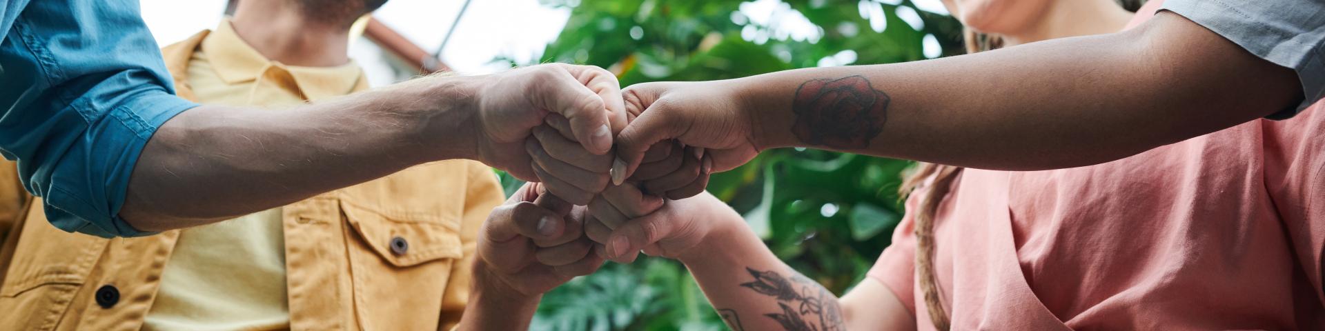 Young people doing fist bump