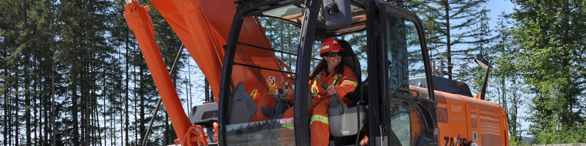 Woman operating heavy machinery