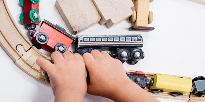 child playing with trains