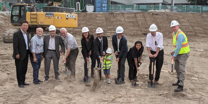 People standing at a groundbreaking