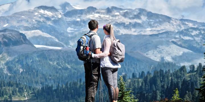 A couple standing at the top of a hike in Vancouver