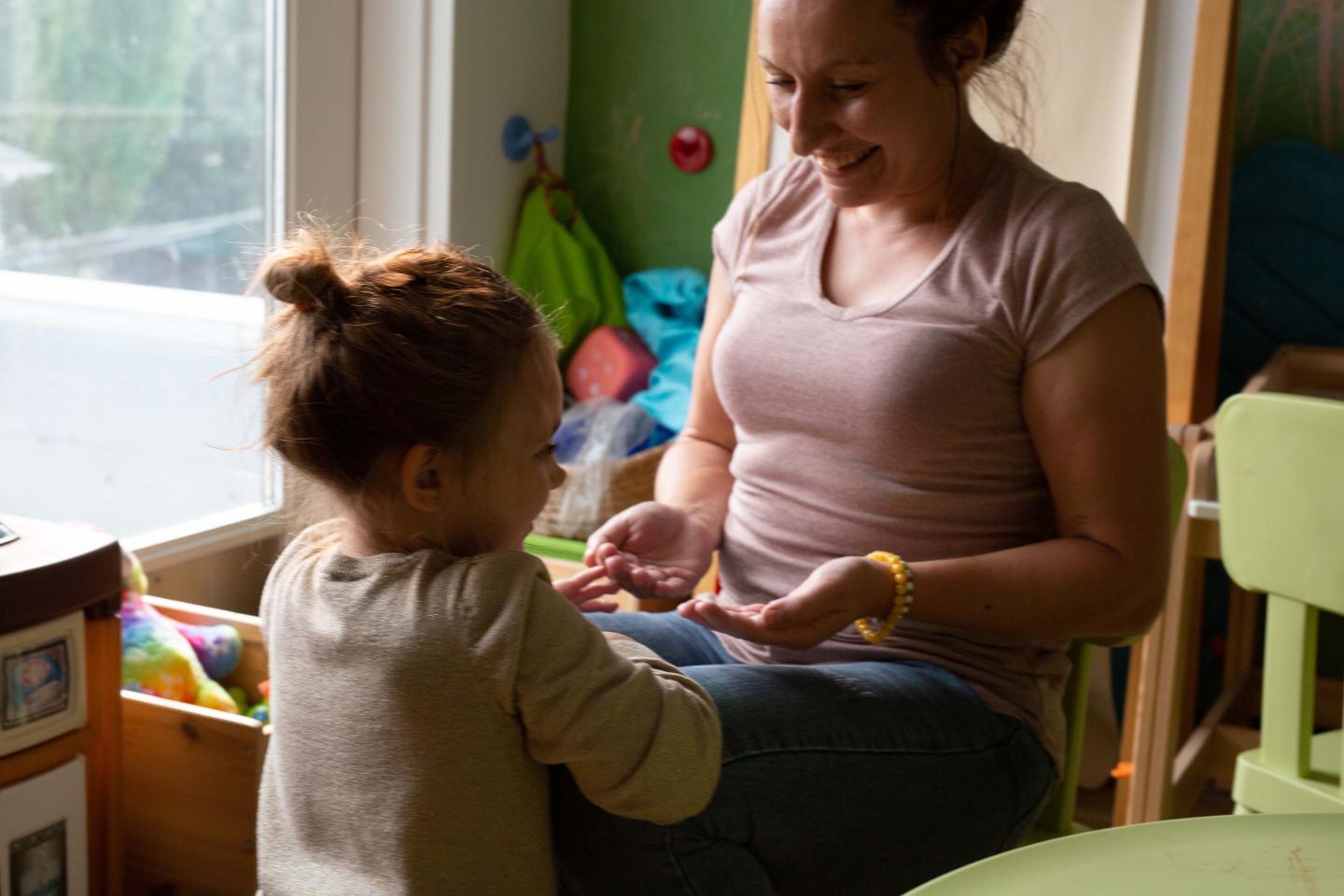 Photo of a single mom with her child at a YWCA Housing Community