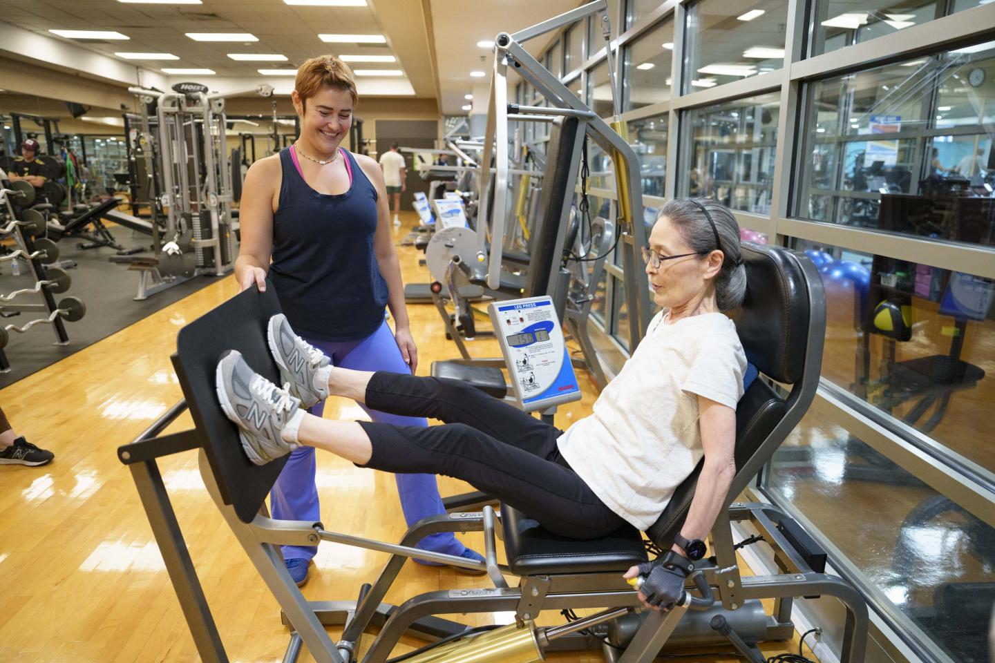 Trainer and trainee in the gym