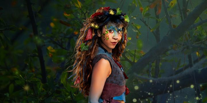 Bard on the Beach promotional banner for Midsummer Night's Dream, showing a women dressed as a fairy