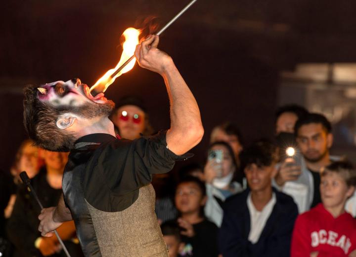 Photo of performer swallowing fire at Fright Nights