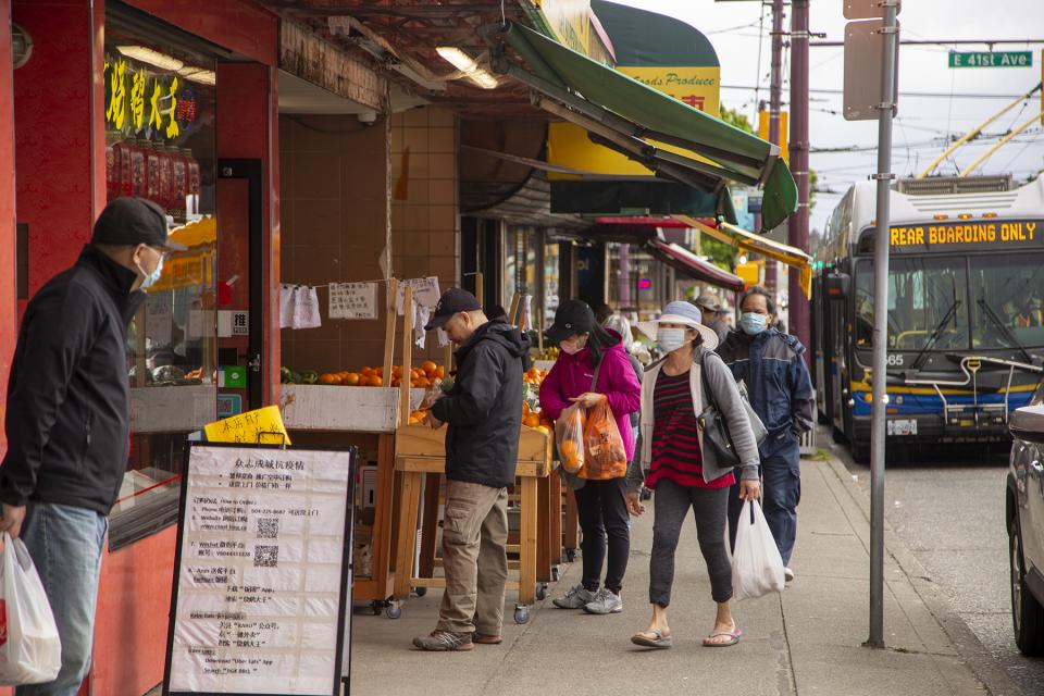 Locals shopping at a local grocer at Victoria Drive