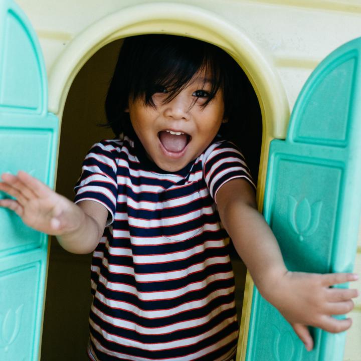 Happy kid at playhouse