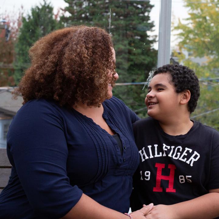 Photo of a single mom with her child at a YWCA Housing Community