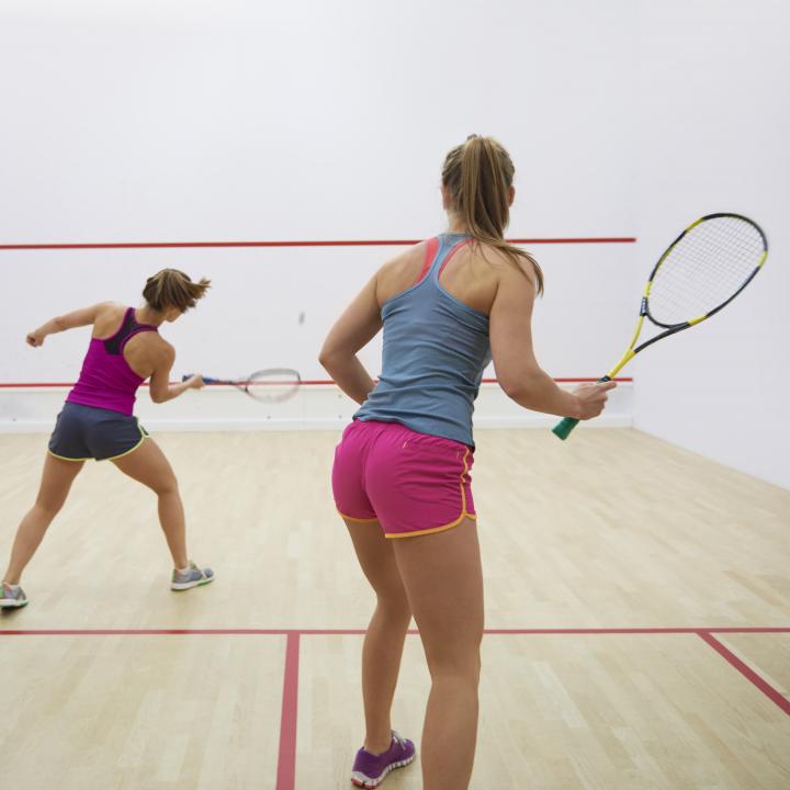 women playing squash