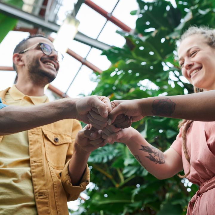 Young people fist bump